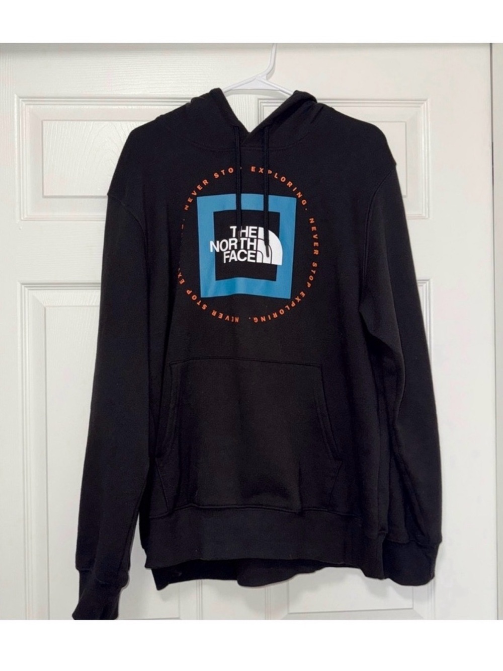 The North Face Black Pullover Hoodie with Blue Logo and Orange Accents